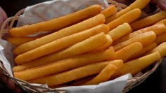 a basket filled with french fries sitting on top of a table