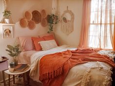 a bed room with a neatly made bed and baskets on the wall