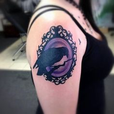 a woman with a bird tattoo on her arm