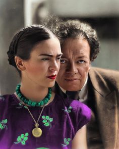 an older man and young woman sitting next to each other