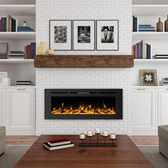 a living room with a fire place and books on the shelves in front of it