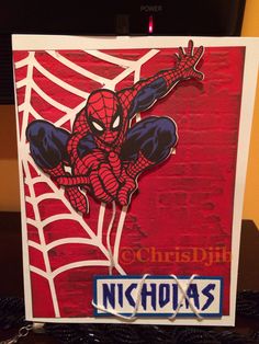 a card with a spider man on it