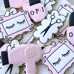 decorated cookies with eyelashes and frames on them