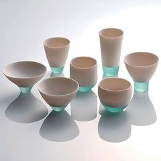 a group of white cups sitting next to each other