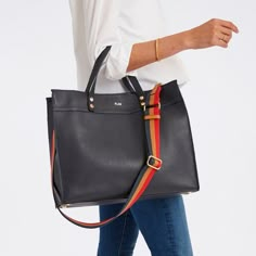 Crafted from high quality leather, our Essential Leather Tote features a spacious, open-tote design with leather carry handles and an adjustable, leather crossbody strap that can be swapped out for one of our colorful straps to create your own style. Add a foil debossed monogram to add a personal touch to your new everyday tote.    Small: 10"w x 5"d x 9"h  Large: 15"w x 5"d x 12.5"h  Camel: Smooth leather with a soft linen lining and gold-toned hardware.  Navy, Black, Sand: Pebbled leather with Handbag Essentials, Suede Tote, Laptop Tote, Mark And Graham, Work Tote, Everyday Tote, Painting Leather, Handbag Straps, Work Bag