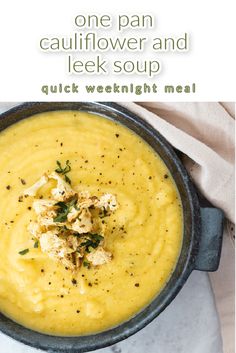 a close up of a bowl of soup on a table with the words, one pan cauliflower and leek soup quick weeknight meal