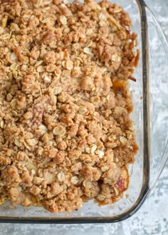 a glass casserole dish filled with apple crisp