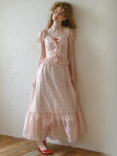 This product is a polka-dot dress adorned with delicate ruffles and bows, offering a romantic and feminine aesthetic. The dress features a flattering sweetheart neckline and a tiered ruffle skirt that enhances its whimsical charm. It is crafted from a lightweight fabric that ensures both comfort and a graceful drape. - This dress showcases a polka-dot pattern paired with ruffled detailing, creating a charming and playful look.- It is designed with a sweetheart neckline that adds a touch of elegance and flattery to the silhouette.- The tiered ruffle skirt not only adds volume but also allows for fluid movement, perfect for a variety of occasions.- Constructed from a lightweight fabric, the dress remains comfortable and breathable throughout the day, making it ideal for spring and summe Feminine Square Neck Dress With Bow, Pink Midi Dress With Sweetheart Neckline And Ruffles, Feminine Midi Dress With Ruffles And Square Neck, Feminine Midi Dress With Square Neck And Ruffles, Feminine Square Neck Midi Dress With Ruffles, Feminine Polka Dot Dress With Ruffle Hem, Cute Polka Dot Dress With Ruffles, Sweet Spring Dress With Sweetheart Neckline, Polka Dot Ruffled Dresses For Daywear