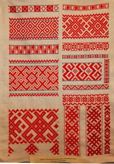 an old red and white cloth with different designs