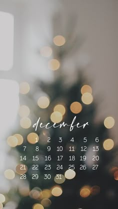 a christmas tree with lights in the background and a calendar on it's side