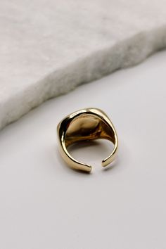 The Cecilia Gold Hammered Ring – a stunning piece that combines rustic charm with modern elegance. This exquisite ring features a beautifully hammered texture, creating a unique and eye-catching design that adds depth and character to your jewelry collection. Crafted from high-quality gold, the Cecilia ring exudes a warm, radiant glow that complements any outfit. The hammered finish provides a distinctive, artisanal look, making each ring subtly unique. Its versatile design ensures it can be wor Summer Dresses Shoes, Gold Shirt, Hammered Ring, Faux Leather Purse, Hammered Rings, Studded Necklace, Faux Leather Belts, Best Birthday Gifts, Bar Earrings