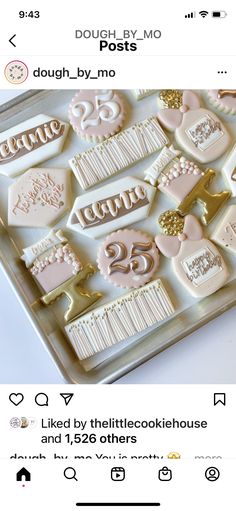 the cookies are decorated with gold and white icing