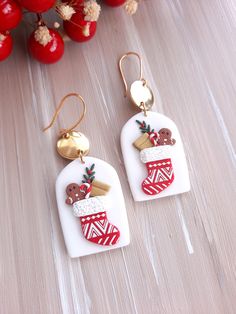 pair of christmas stocking earrings on wooden table