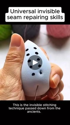 a person holding a white object with black dots on it's face and the words universal invisible seam repairing skills