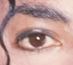 an image of a man's brown eye looking straight ahead