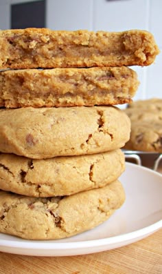 a stack of cookies sitting on top of a white plate