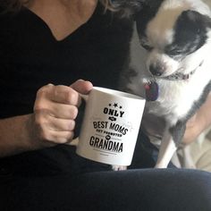 a woman holding a coffee mug with a dog on her lap and the words start with dream written all over it