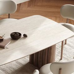 a table with two chairs and a book on it