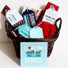 a basket filled with lots of different types of cards and tags on top of it