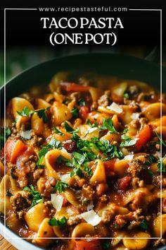 a close up of a bowl of taco pasta on a wooden table with text overlay