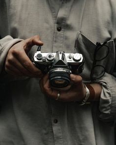 a man holding a camera in his hands