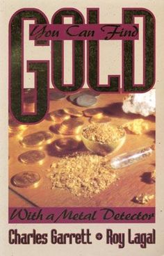 a book cover with gold coins and other items on the table in front of it