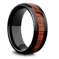 a black ceramic ring with wooden inlay