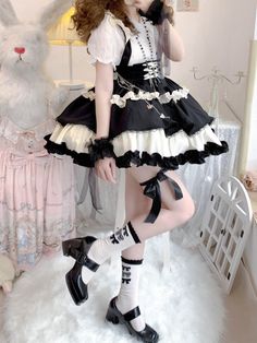 This stunning Lolita skirt features a charming black and white color scheme, accentuated by a lace-up front and a high waist design for a flattering fit. The detachable straps add a versatile touch, allowing you to customize your look. Embrace the sweet and elegant Lolita style with this beautiful skirt that is perfect for any occasion.   	 		 			Size 			S 			M 			L 		 		 			Waist 			58-82 			64-88 			72-94 		 		 			Full Length 			43 			44 			45 		 		 			Hem Circumference 			426 			426 			426 Harajuku Style Black Ruffled Bottoms, Cute Black Party Skirt, Cute Black Skirt With Ruffles, White Harajuku Skirt With Ruffles, White Harajuku Style Ruffled Skirt, Cute Fitted Black Skirt, Cute Black Mini Skirt For Party, Black Mini Dress With Ruffled Skirt, Cute Black Bottoms For Party