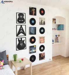 there are many records on the wall in this room