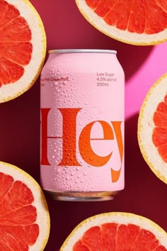 a can of heiney is surrounded by grapefruit and grapefruit