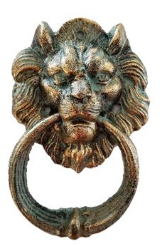 a metal lion head door knockle on a white background