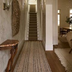 the hallway is clean and ready for guests to use it as an entrance way into the house