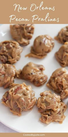 a white plate topped with cookies covered in peanut butter and chocolate frosting next to text that reads new orleans pecan pralies