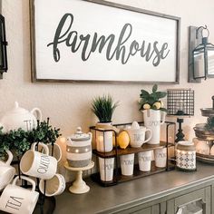 a coffee bar with cups and mugs on the counter next to a sign that says farmhouse