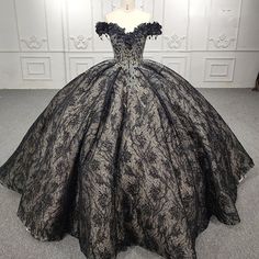 Make a bold and unforgettable statement in the Quinceanera Black Off-the-Shoulder Ball Gown Dress. This exquisite ball gown features an off-the-shoulder neckline that adds a touch of sophistication and allure, while the sleeveless design ensures you feel graceful and free. The rich black tulle fabric creates a voluminous silhouette, perfect for a grand and dramatic look. The dress is adorned with intricate applique detailing and delicate beading, adding sparkle and texture that catches the light Black Ball Gown Dress, Gothic Fairytale, Quinceanera Dresses Black, Quinceanera Dresses Red, Champagne Quinceanera Dresses, White Quinceanera Dresses, Purple Quinceanera Dresses, Black Quinceanera Dresses, Quinceanera Dresses Gold