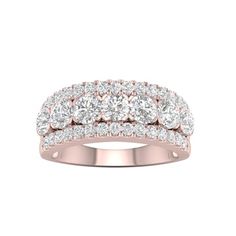 a rose gold ring with five diamonds