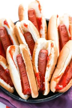 hot dogs in buns with ketchup and mustard