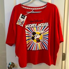 Nwt Disney Classic Mickey Mouse Colorburst Graphic T-Shirt Condition: All Are Brand New, Never Worn, With Original Tags. Description: Grab This Classic Disney Merch For A Much Better Price Than Retail And Rock This Adorable, Comfy, And Colorful, Old-School Mickey Tee With Pride. Features: Authentic, Licensed Disney Large Mickey Mouse Graphic Machine Washable Soft Cotton Polyblend Colors: Red With White/Blue/Red/Yellow Colorburst & Mickey Mouse Graphic In Center. Sizing: U.S. Women’s Large & Extr Multicolor Cartoon Print Tops For Disney Fan Events, Disney Mickey Mouse Fan Merchandise Tops, Pop Culture Crew Neck Tops For Disney Fan Events, Multicolor Disney Crew Neck T-shirt, Pop Culture Mickey Mouse Tops For Disney Fan Events, Retro Cartoon Print Tops For Disney Fan Events, Fun Mickey Mouse Tops For Disney Fan Events, Multicolor Mickey Mouse T-shirt For Disney Events, Fun Mickey Mouse Short Sleeve Tops