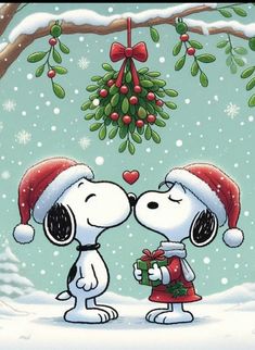 snoopy and his friend are giving each other a kiss in front of a christmas tree