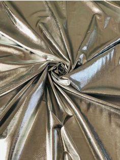 an image of metallic fabric that looks like it is going to be made into something