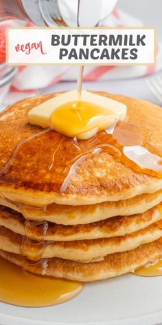 a stack of pancakes with butter and syrup on top