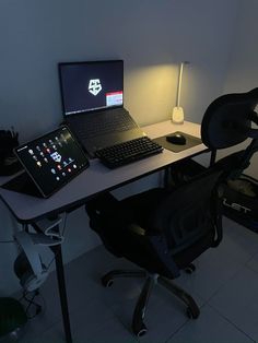 a laptop computer sitting on top of a desk