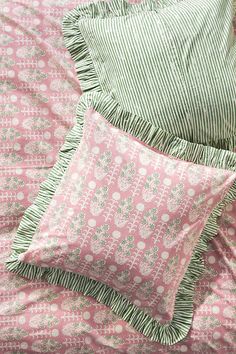 pink and green bedding with white polka dots