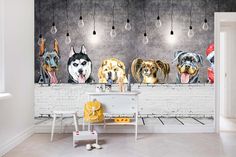 four dogs are hanging on the wall next to a table