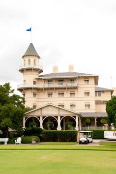 a large white building with a clock tower