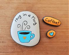 two rocks that say hug in a mug and coffee