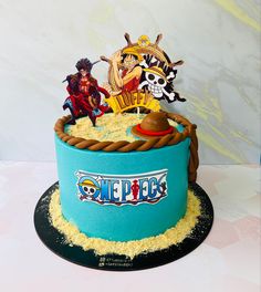 a birthday cake with pirates on top