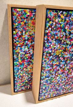 two wooden frames with colorful confetti on them