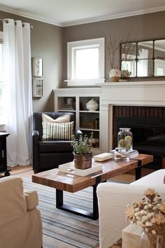 a living room filled with furniture and a fire place