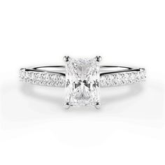 a princess cut diamond ring with pave set shoulders